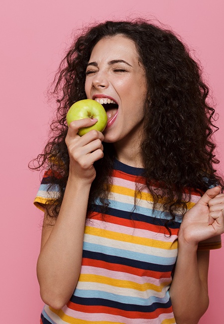 Person eating an apple